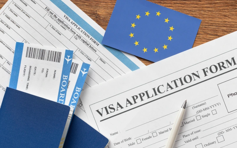 Schengen visa application form with EU flag and boarding passes