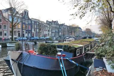 Scenic Canal View with Houseboats in Amsterdam